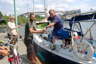 John Doe accepts peas from Capt. Jeff