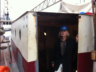 STN reporter and photographer Jan Lundberg in galley & navigation station - photo by Dexter
