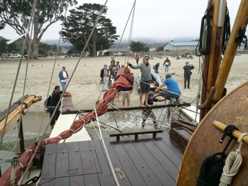 Get on or off shore from canoe, no worries mate. Fog shrouds mountains.