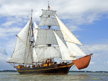 Alternative: the Tres Hombres, sailing cargo transatlantic regularly, no engine