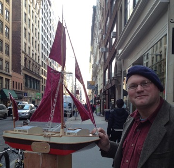 Project Director Erik Andrus with the 1/12th scale model of Ceres